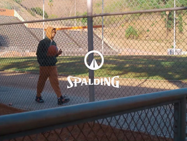 Dior Johnson in a Spalding fashion campaign on an outdoor court