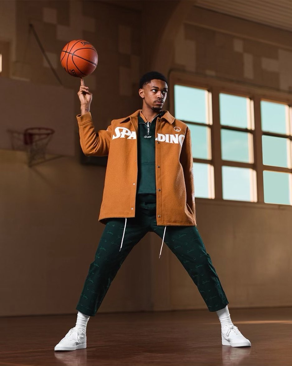 Dior Johnson posing in Spalding and UNKNWN apparel